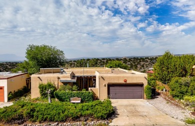 Step through a charming walled courtyard and enter a world of on Pueblo de Cochiti Golf Course in New Mexico - for sale on GolfHomes.com, golf home, golf lot