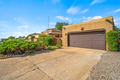 Step through a charming walled courtyard and enter a world of on Pueblo de Cochiti Golf Course in New Mexico - for sale on GolfHomes.com, golf home, golf lot