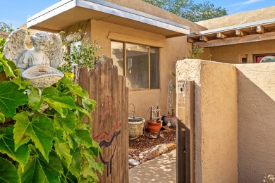 Step through a charming walled courtyard and enter a world of on Pueblo de Cochiti Golf Course in New Mexico - for sale on GolfHomes.com, golf home, golf lot