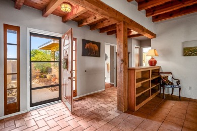 Step through a charming walled courtyard and enter a world of on Pueblo de Cochiti Golf Course in New Mexico - for sale on GolfHomes.com, golf home, golf lot