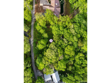 This 2.1-acre lot offers big views, and an installed septic, and on Highlands Country Club in North Carolina - for sale on GolfHomes.com, golf home, golf lot