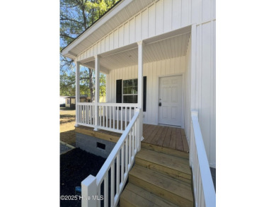 Modern, fresh, and move-in ready, this brand-new 3-bedroom on The Lakes Country Club in North Carolina - for sale on GolfHomes.com, golf home, golf lot