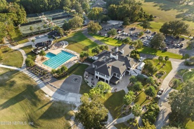 Gorgeous 3-bedroom, 2-bathroom home located on 14th Green in the on Magnolia Point Golf and Country Club in Florida - for sale on GolfHomes.com, golf home, golf lot