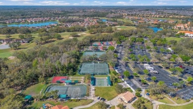 BRAND NEW ROOF! CHARMING HOME IN THE AWARD WINNING COMMUNITY on Stonegate Golf Club in Florida - for sale on GolfHomes.com, golf home, golf lot