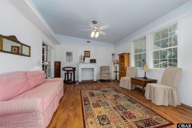 This low country home welcomes you!  The covered front porch on Holly Ridge Golf Course in North Carolina - for sale on GolfHomes.com, golf home, golf lot