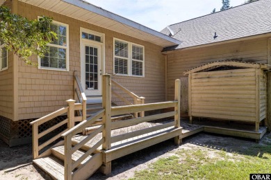 This low country home welcomes you!  The covered front porch on Holly Ridge Golf Course in North Carolina - for sale on GolfHomes.com, golf home, golf lot