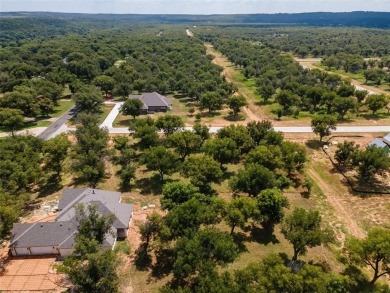 Discover the perfect setting for your dream home on this on Pecan Plantation Country Club in Texas - for sale on GolfHomes.com, golf home, golf lot