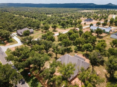 Discover the perfect setting for your dream home on this on Pecan Plantation Country Club in Texas - for sale on GolfHomes.com, golf home, golf lot