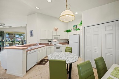 This end-unit residence offers 2 bedrooms plus a den and 2 full on Colonial Country Club in Florida - for sale on GolfHomes.com, golf home, golf lot