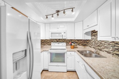 Beautifully updated villa-style condo in Palm Harbor's premier on Highland Lakes Executive Golf Course in Florida - for sale on GolfHomes.com, golf home, golf lot