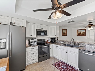 Beautifully remodeled 2-bedroom, 2-bathroom end-unit condominium on Seven Springs Golf and Country Club in Florida - for sale on GolfHomes.com, golf home, golf lot