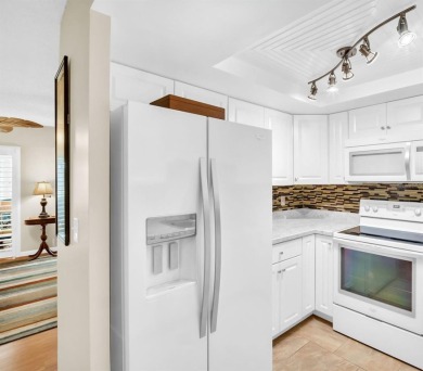 Beautifully updated villa-style condo in Palm Harbor's premier on Highland Lakes Executive Golf Course in Florida - for sale on GolfHomes.com, golf home, golf lot