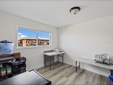 Beautifully remodeled 2-bedroom, 2-bathroom end-unit condominium on Seven Springs Golf and Country Club in Florida - for sale on GolfHomes.com, golf home, golf lot