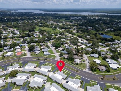 Beautifully updated villa-style condo in Palm Harbor's premier on Highland Lakes Executive Golf Course in Florida - for sale on GolfHomes.com, golf home, golf lot