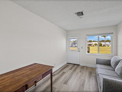 Beautifully remodeled 2-bedroom, 2-bathroom end-unit condominium on Seven Springs Golf and Country Club in Florida - for sale on GolfHomes.com, golf home, golf lot