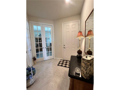 Enjoy expansive, tranquil water and golf course views that you on Panther Run Golf Club in Florida - for sale on GolfHomes.com, golf home, golf lot