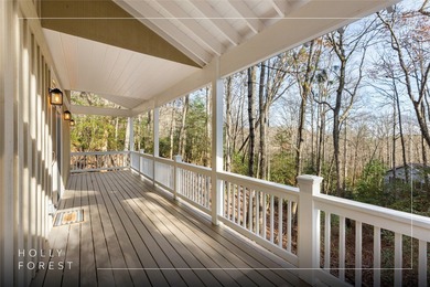 Nestled in the Holly Forest community of Sapphire, North on Sapphire National Golf Club in North Carolina - for sale on GolfHomes.com, golf home, golf lot