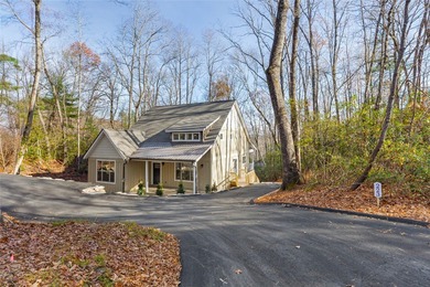 Nestled in the Holly Forest community of Sapphire, North on Sapphire National Golf Club in North Carolina - for sale on GolfHomes.com, golf home, golf lot