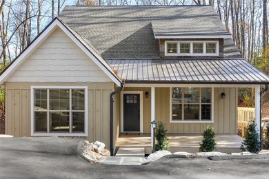 Nestled in the Holly Forest community of Sapphire, North on Sapphire National Golf Club in North Carolina - for sale on GolfHomes.com, golf home, golf lot