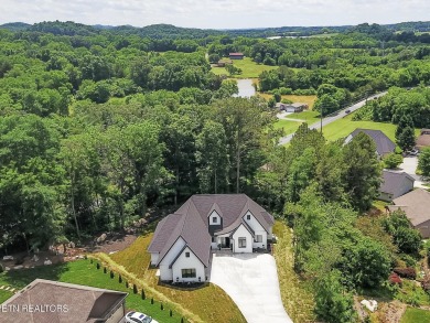Welcome to 205 Inagehi Trace, a custom-built masterpiece in the on Tellico Village Golf Club in Tennessee - for sale on GolfHomes.com, golf home, golf lot