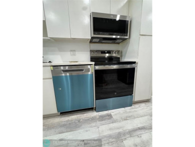 OWNER FINANCING AVAILABLE... EV ELECTRIC CHARGER  installed in on Palm-Aire Country Club and Resort - Palms in Florida - for sale on GolfHomes.com, golf home, golf lot