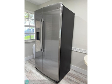 OWNER FINANCING AVAILABLE... EV ELECTRIC CHARGER  installed in on Palm-Aire Country Club and Resort - Palms in Florida - for sale on GolfHomes.com, golf home, golf lot