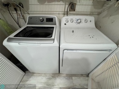 OWNER FINANCING AVAILABLE... EV ELECTRIC CHARGER  installed in on Palm-Aire Country Club and Resort - Palms in Florida - for sale on GolfHomes.com, golf home, golf lot