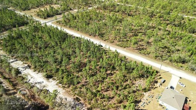 Build your dream home on this spacious 0.50-acre vacant lot on Indian Lake Estates Golf and Country Club in Florida - for sale on GolfHomes.com, golf home, golf lot