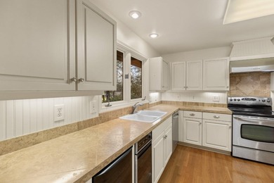 Enjoy the huge decks and flat yard from this well maintained 3- on Highlands Country Club in North Carolina - for sale on GolfHomes.com, golf home, golf lot