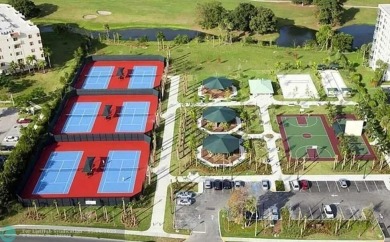 OWNER FINANCING AVAILABLE... EV ELECTRIC CHARGER  installed in on Palm-Aire Country Club and Resort - Palms in Florida - for sale on GolfHomes.com, golf home, golf lot