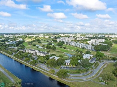 OWNER FINANCING AVAILABLE... EV ELECTRIC CHARGER  installed in on Palm-Aire Country Club and Resort - Palms in Florida - for sale on GolfHomes.com, golf home, golf lot