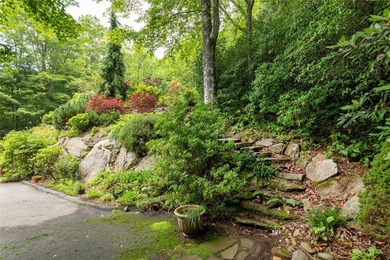 This one-of-a-kind, beautifully maintained four-bedroom on Lake Toxaway Country Club in North Carolina - for sale on GolfHomes.com, golf home, golf lot
