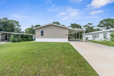 Welcome to this STUNNING and spacious open floor plan home on Brookridge Country Club in Florida - for sale on GolfHomes.com, golf home, golf lot