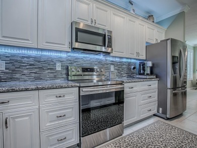Enjoy maintenance-free living in this spacious 2-bedroom, 2-bath on Arlington Ridge Golf Club in Florida - for sale on GolfHomes.com, golf home, golf lot