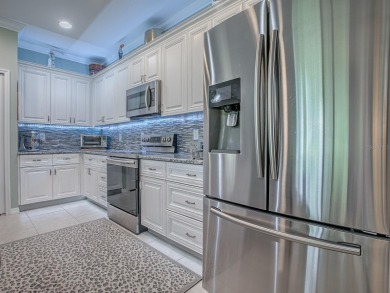 Enjoy maintenance-free living in this spacious 2-bedroom, 2-bath on Arlington Ridge Golf Club in Florida - for sale on GolfHomes.com, golf home, golf lot