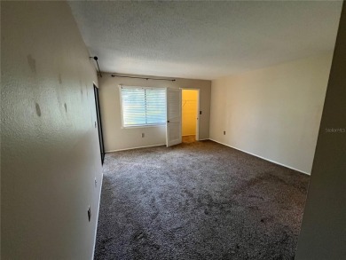 Welcome to this inviting first-floor, 2-bedroom, 2-bath condo in on East Lake Woodlands Country Club in Florida - for sale on GolfHomes.com, golf home, golf lot