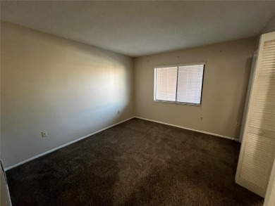 Welcome to this inviting first-floor, 2-bedroom, 2-bath condo in on East Lake Woodlands Country Club in Florida - for sale on GolfHomes.com, golf home, golf lot