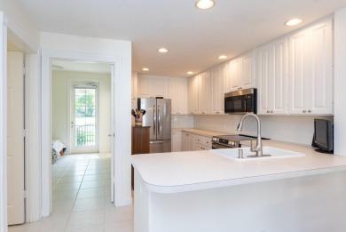 Welcome home to this beautiful end unit townhome in the heart of on Abacoa Golf Club in Florida - for sale on GolfHomes.com, golf home, golf lot