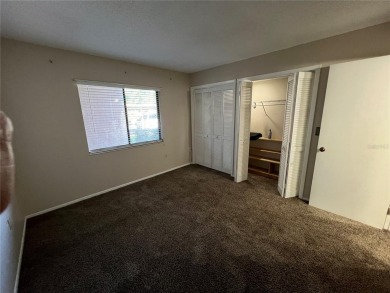 Welcome to this inviting first-floor, 2-bedroom, 2-bath condo in on East Lake Woodlands Country Club in Florida - for sale on GolfHomes.com, golf home, golf lot