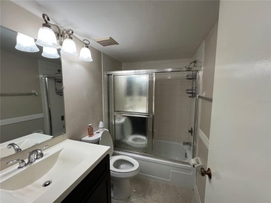 Welcome to this inviting first-floor, 2-bedroom, 2-bath condo in on East Lake Woodlands Country Club in Florida - for sale on GolfHomes.com, golf home, golf lot