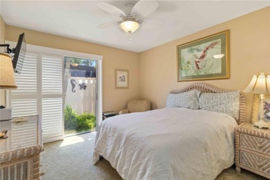 Winding tree-lined roads lead to Sea Grape Villas, where this on Bird Bay Executive Golf Club in Florida - for sale on GolfHomes.com, golf home, golf lot