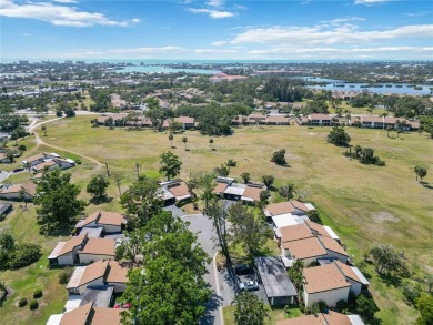 Winding tree-lined roads lead to Sea Grape Villas, where this on Bird Bay Executive Golf Club in Florida - for sale on GolfHomes.com, golf home, golf lot