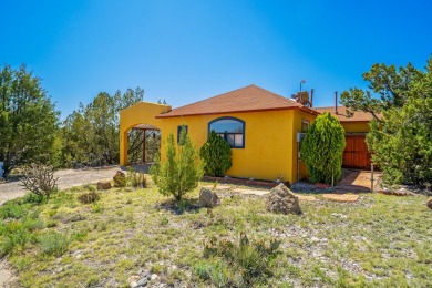 Nestled privately among Pinon and Juniper trees at Cochiti Lake on Pueblo de Cochiti Golf Course in New Mexico - for sale on GolfHomes.com, golf home, golf lot