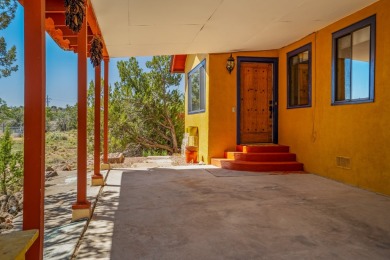 Nestled privately among Pinon and Juniper trees at Cochiti Lake on Pueblo de Cochiti Golf Course in New Mexico - for sale on GolfHomes.com, golf home, golf lot