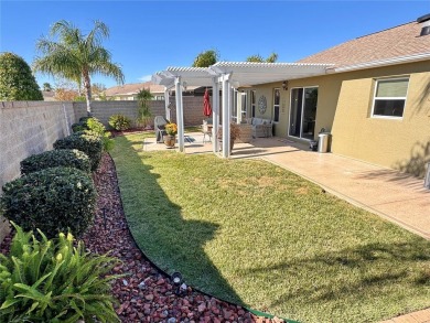 This three bedroom and two bath Anaheim courtyard villa will on Yankee Clipper Executive Golf Course in Florida - for sale on GolfHomes.com, golf home, golf lot