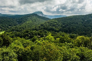 A superb, gently sloping building lot with stunning views of on Highlands Falls Country Club in North Carolina - for sale on GolfHomes.com, golf home, golf lot