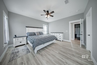 This Gold Fortified beach home, built in 2023, is just a short on Kiva Dunes Golf Club in Alabama - for sale on GolfHomes.com, golf home, golf lot