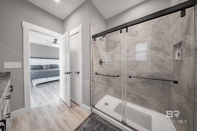 This Gold Fortified beach home, built in 2023, is just a short on Kiva Dunes Golf Club in Alabama - for sale on GolfHomes.com, golf home, golf lot