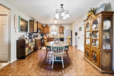 This charming 3 bedroom, 2 bath home is nestled in the highly on Silver Springs Country Club in Arkansas - for sale on GolfHomes.com, golf home, golf lot