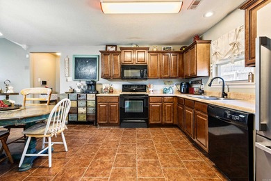 This charming 3 bedroom, 2 bath home is nestled in the highly on Silver Springs Country Club in Arkansas - for sale on GolfHomes.com, golf home, golf lot